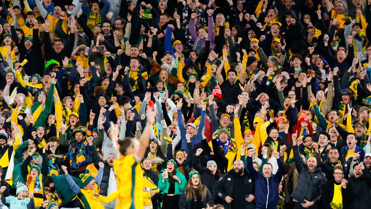 The crowd goes wild after Australia scores in a Women's World Cup semi-final. Picture by Anna Warr