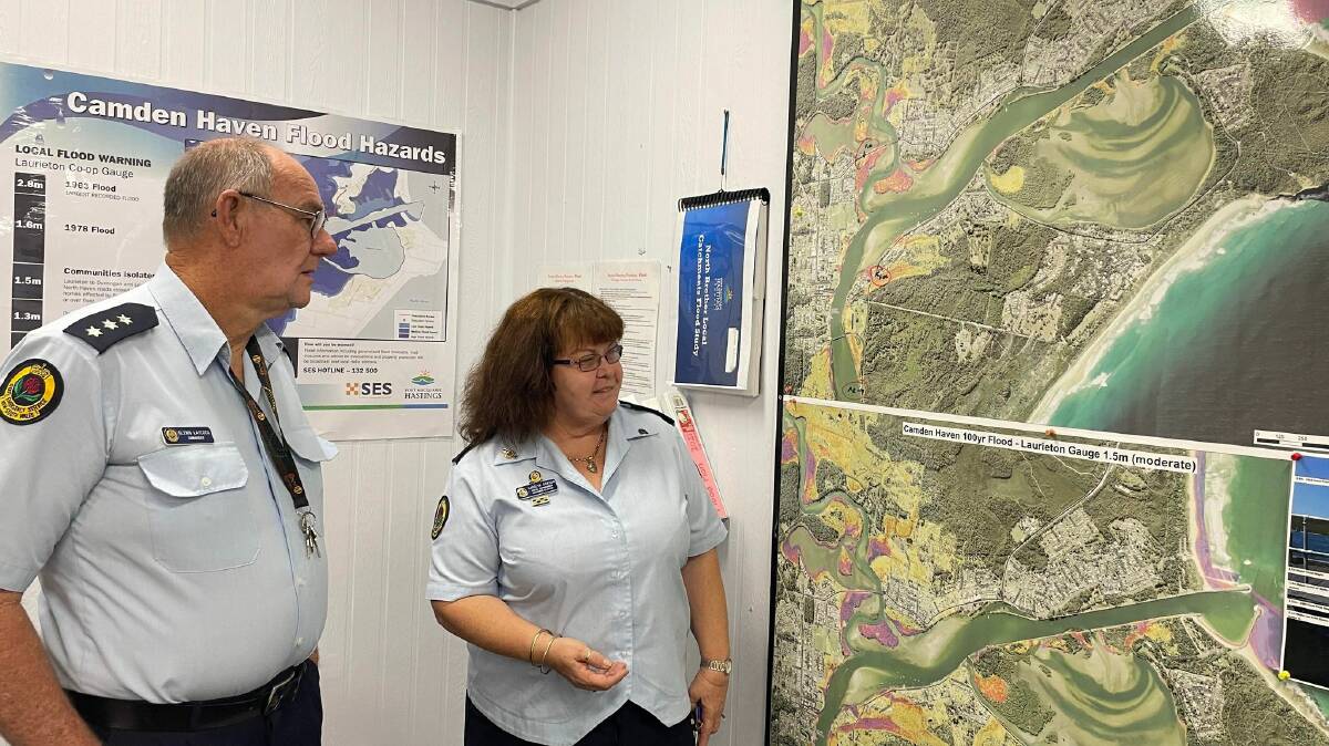 Examining maps at the NSW SES Camden Haven Unit. Picture by Liz Langdale 