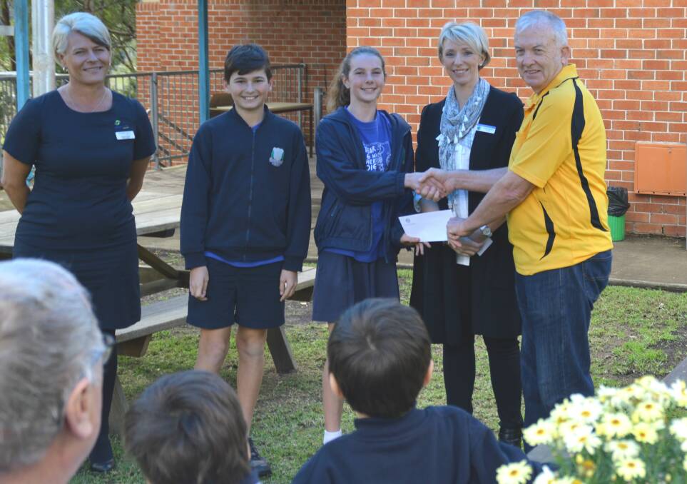 DONATION APPRECIATED: Rachel O'Neill and Graham Hare from Laurieton Rotary present a cheque to Kendall Public School principal Jodie Paterson and school leaders Jasmine O’Brien and Jaspa Calicetto.