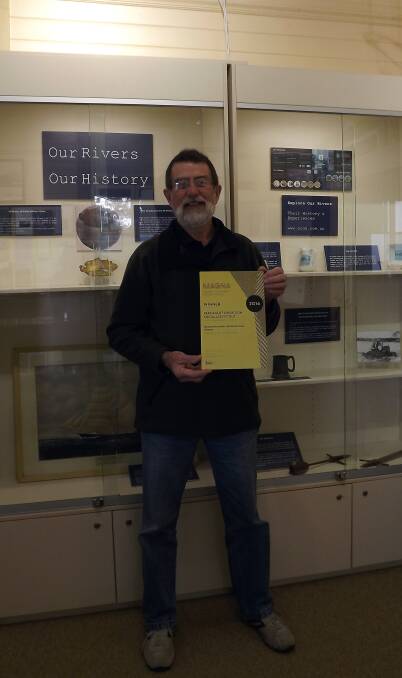 CHUFFED: Camden HAven Historical Society president Phillip Bowman with the museum's award.